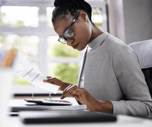 Woman using calculator
